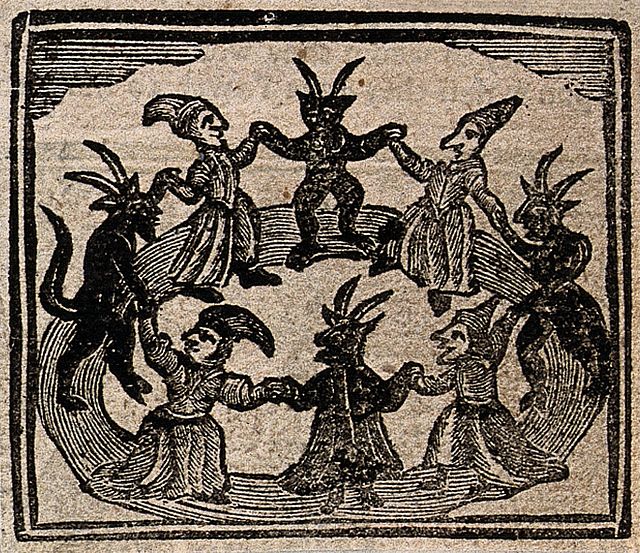 A ring of dancers: human and horned demonic figures hold hands in a ritual circle